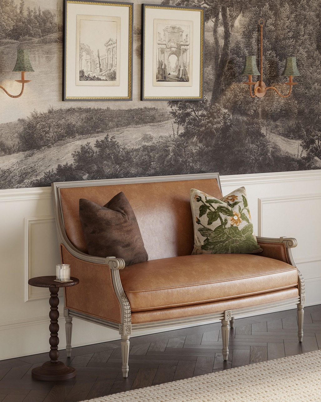 A leather settee sits against a wall in a traditional dining room with framed drawings and double-armed sconces above it