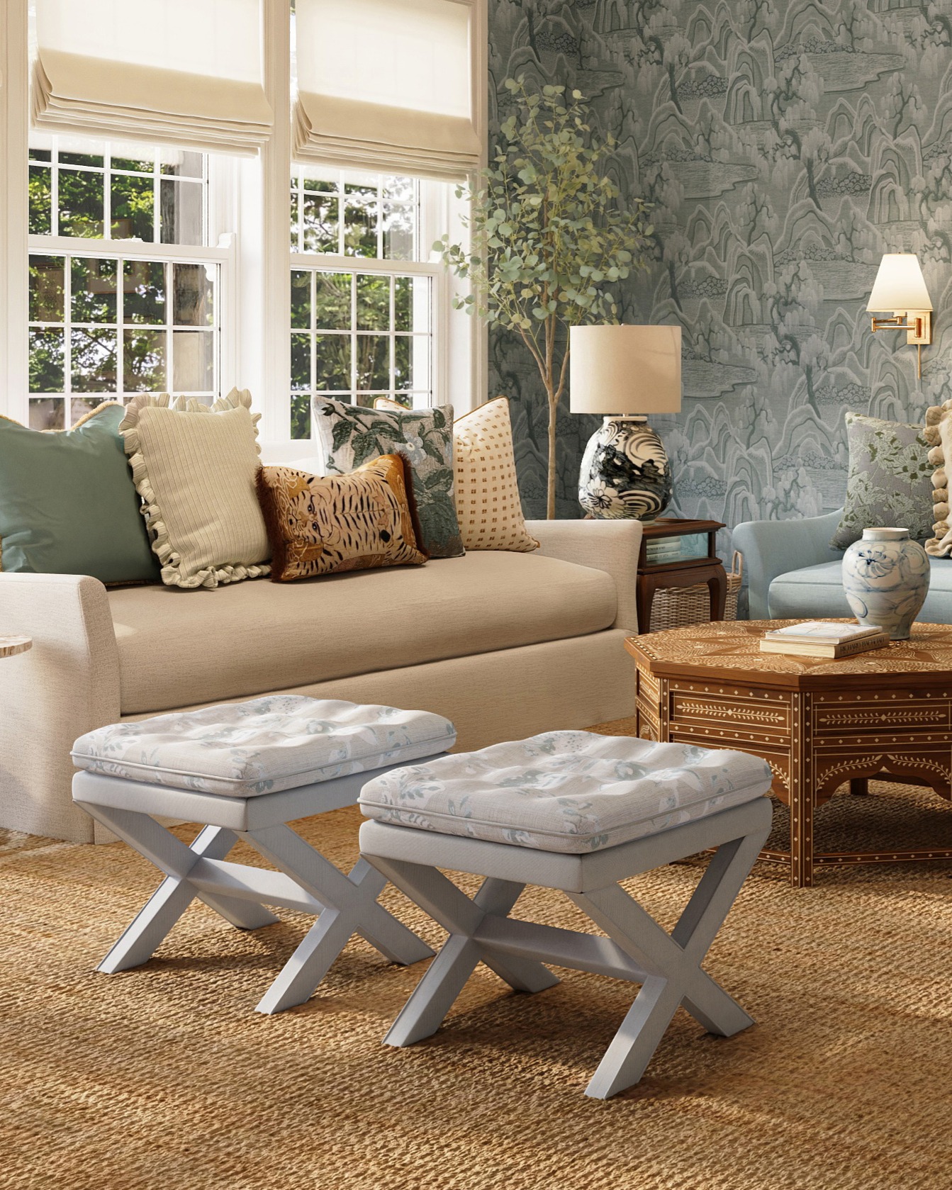 an x-base stool with striped upholstered legs and a botanical tufted cushion sits in a cozy lakeside living room with blue wallpaper on the walls